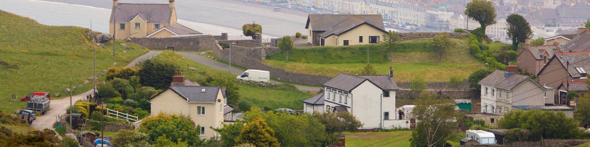 Great Orme featuring a small town or village and farmland