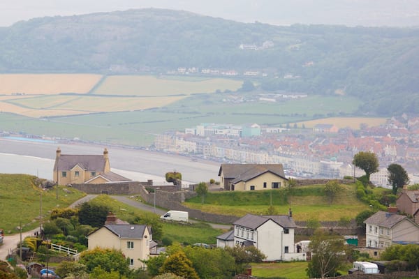 Great Orme featuring a small town or village and farmland
