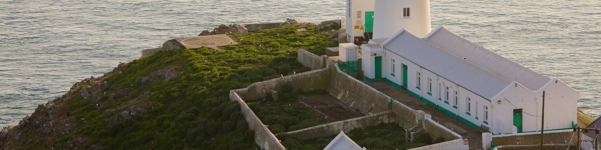 South Stack Lighthouse which includes a lighthouse and general coastal views