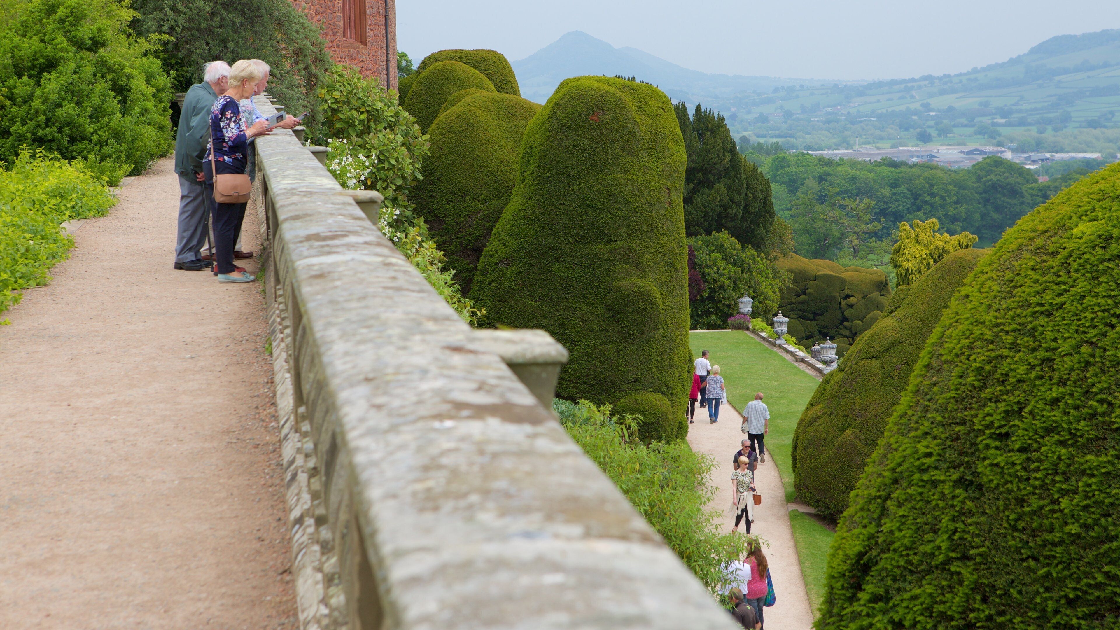 Powis Castle featuring a garden, heritage elements and chateau or palace