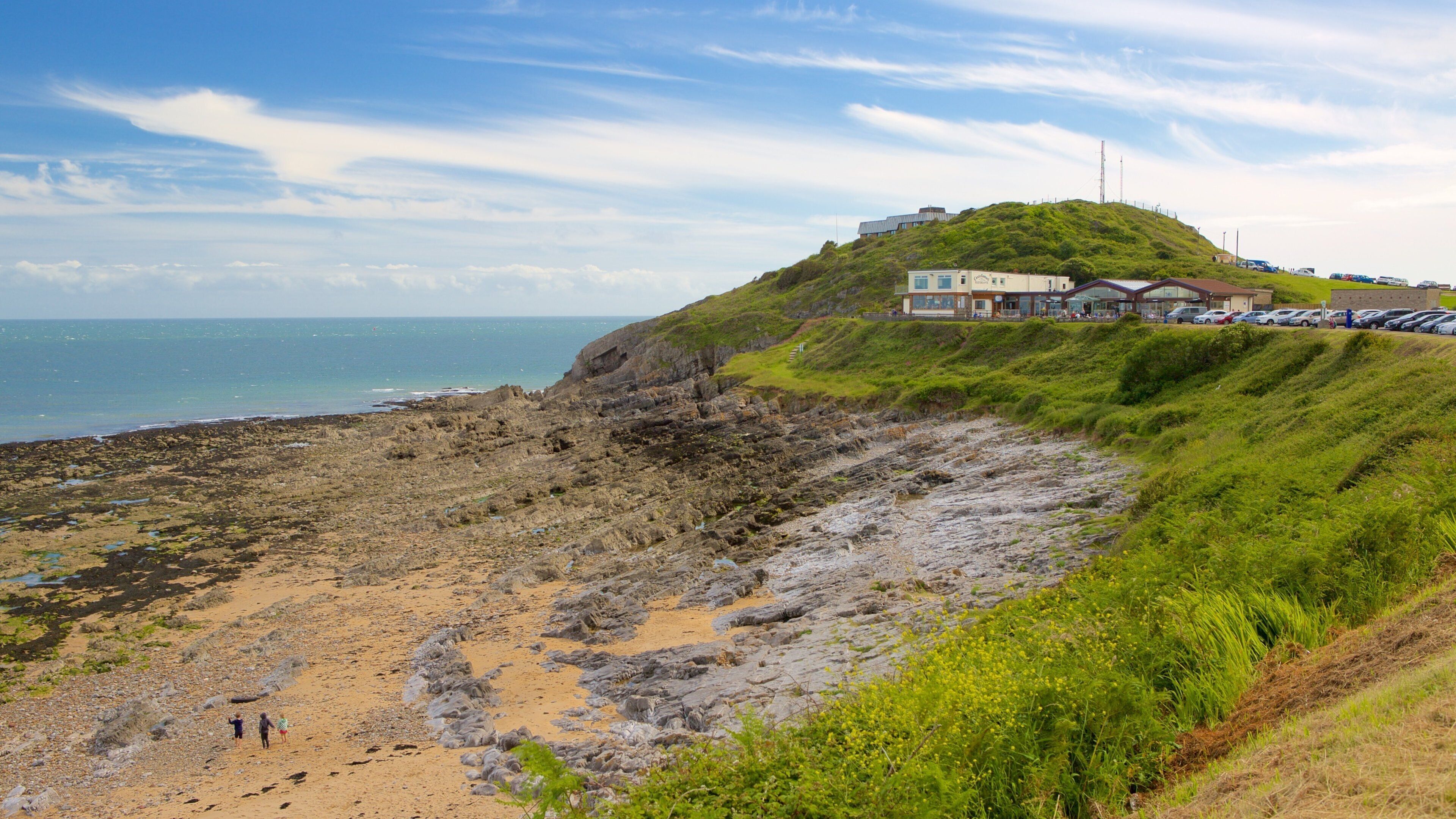 Bracelet Bay Beach which includes rugged coastline and general coastal views