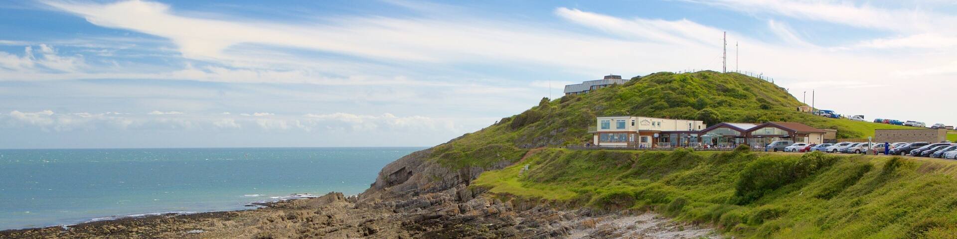 Bracelet Bay Beach which includes rugged coastline and general coastal views