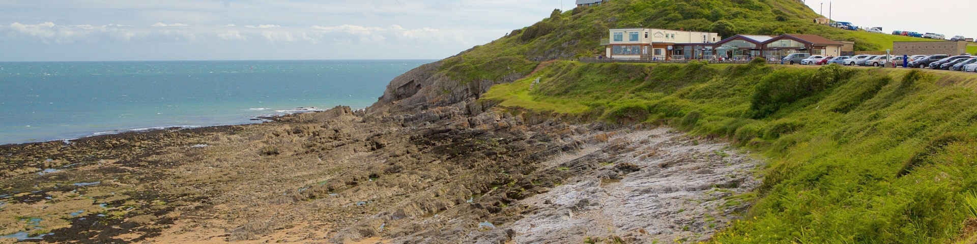 Bracelet Bay Beach which includes rugged coastline and general coastal views