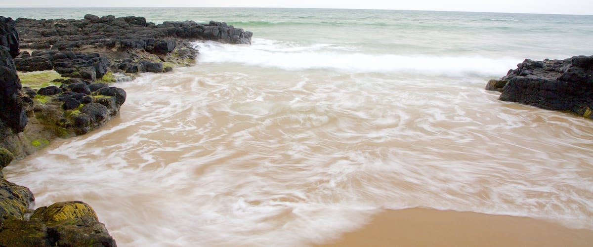 Castlerock Beach which includes rocky coastline, general coastal views and a beach