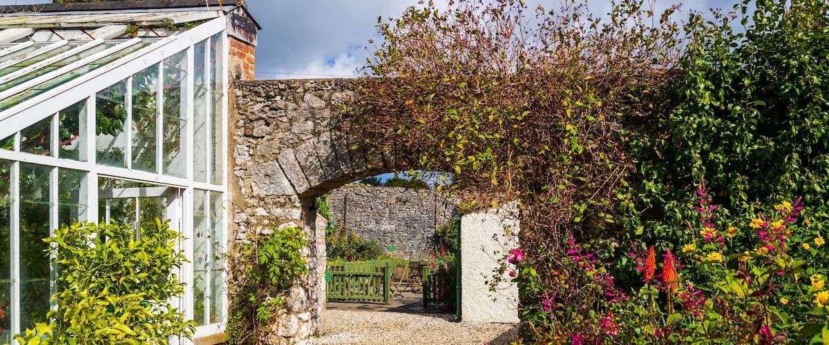 Glenarm Castle which includes a park and wildflowers