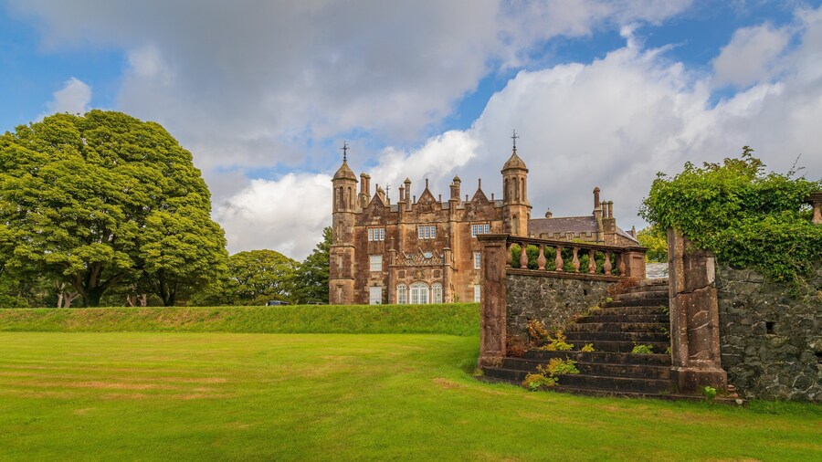 Glenarm Castle showing a park, heritage architecture and chateau or palace
