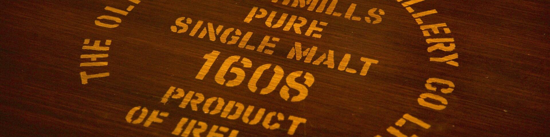 Old Bushmills Distillery featuring signage