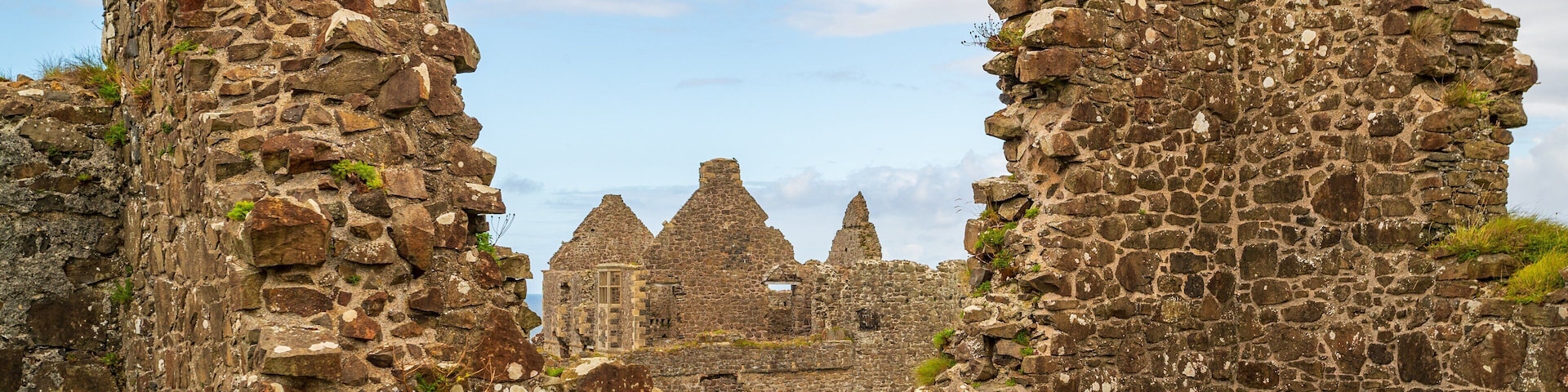 Dunluce Castle showing heritage elements and a ruin