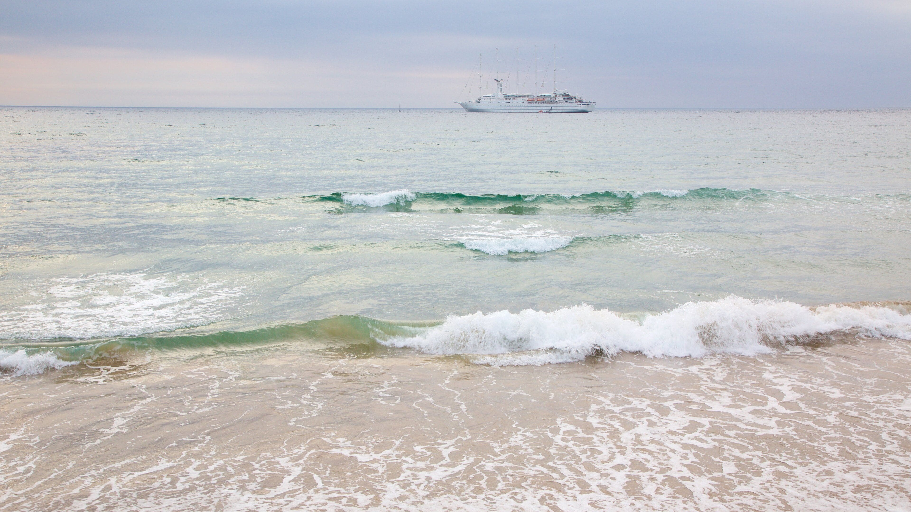 Portrush East Strand Beach which includes cruising, general coastal views and a sandy beach