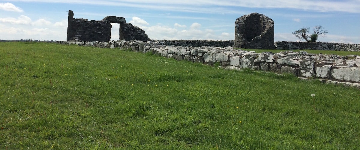 6 miles outside Comber on Strangford Lough. This historic landmark is featured on the St.Patricks trail. 
The road leading to it from Comber is stunning on a beautiful sunny day.