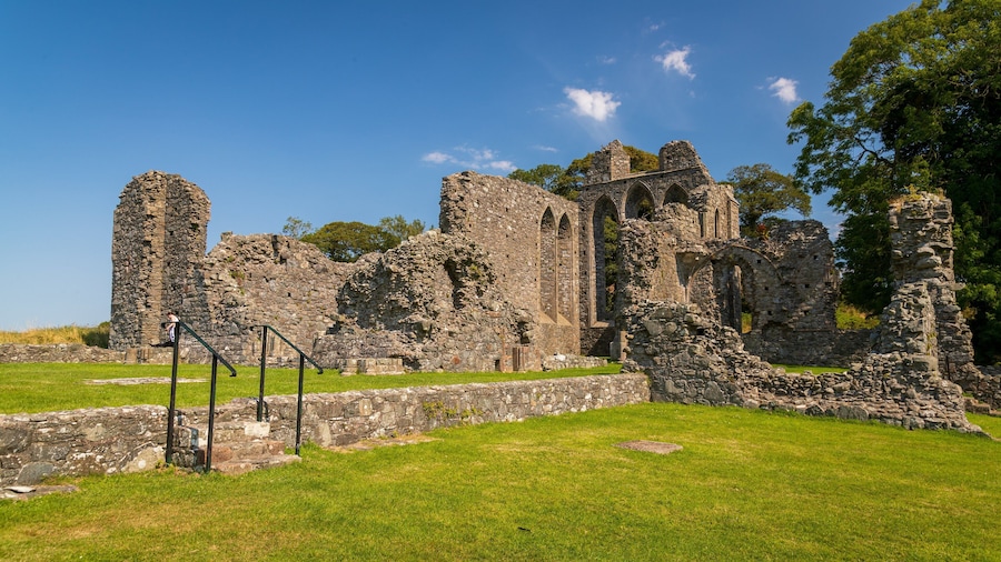 Inch Abbey which includes building ruins and heritage elements