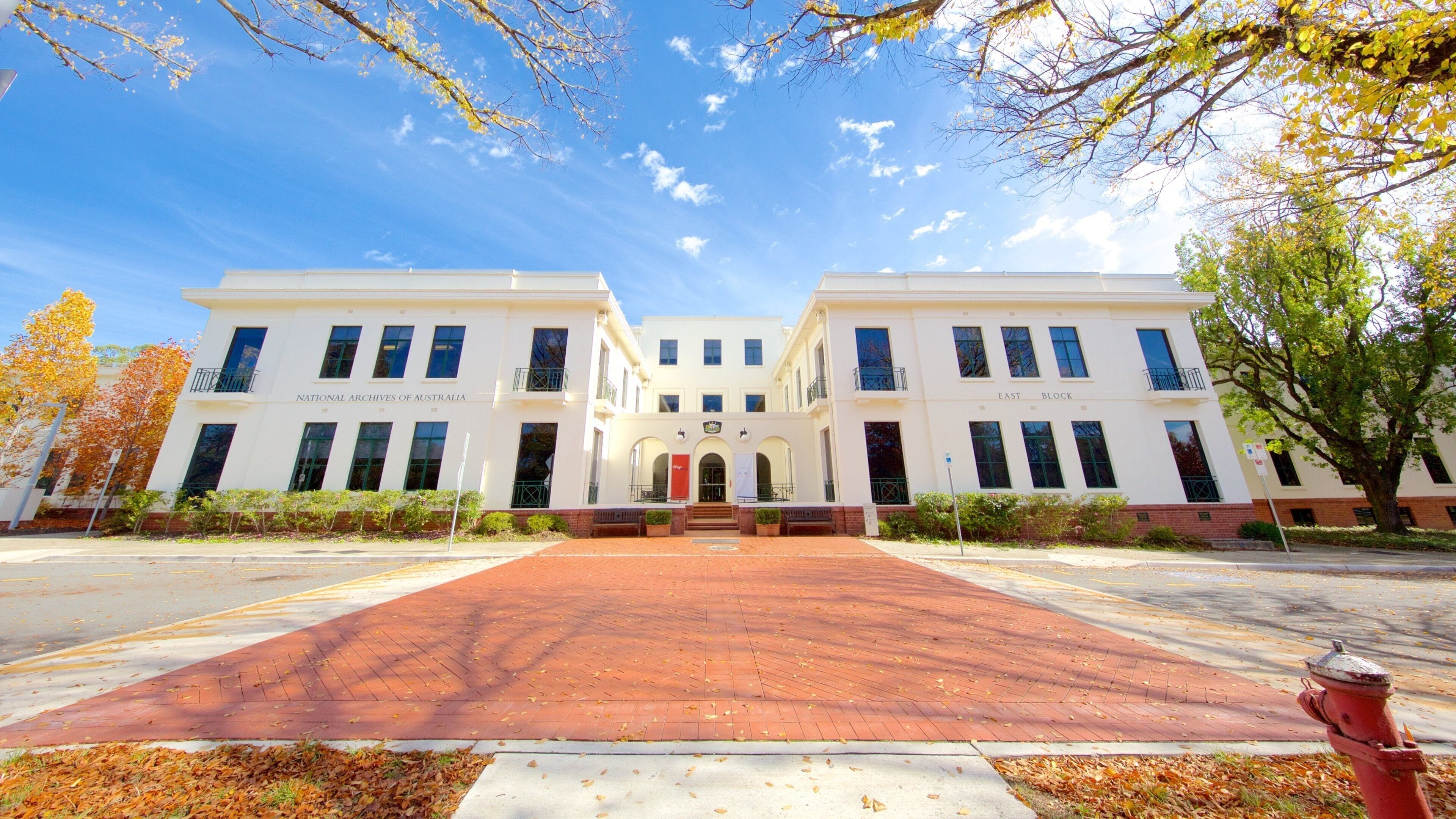 A building labeled "National Archives of Australia" with a red brick pathway leading to the entrance.
