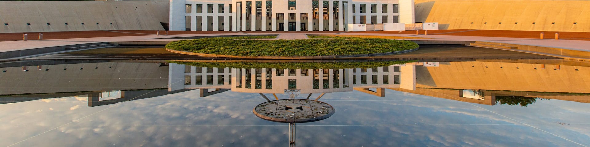 Parliament House which includes a sunset and an administrative buidling