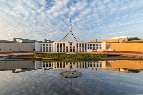 Parliament House which includes a sunset and an administrative buidling
