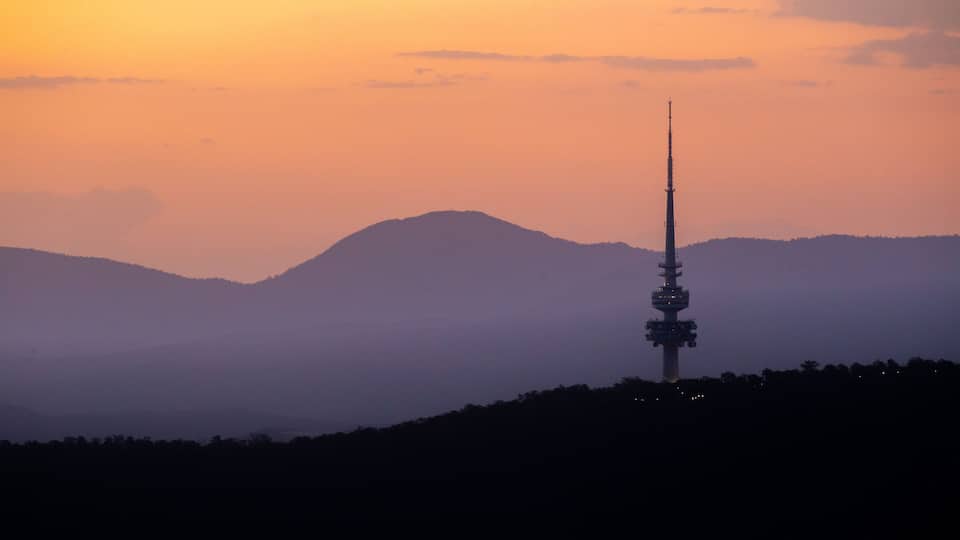 Telstra Tower featuring a sunset and landscape views