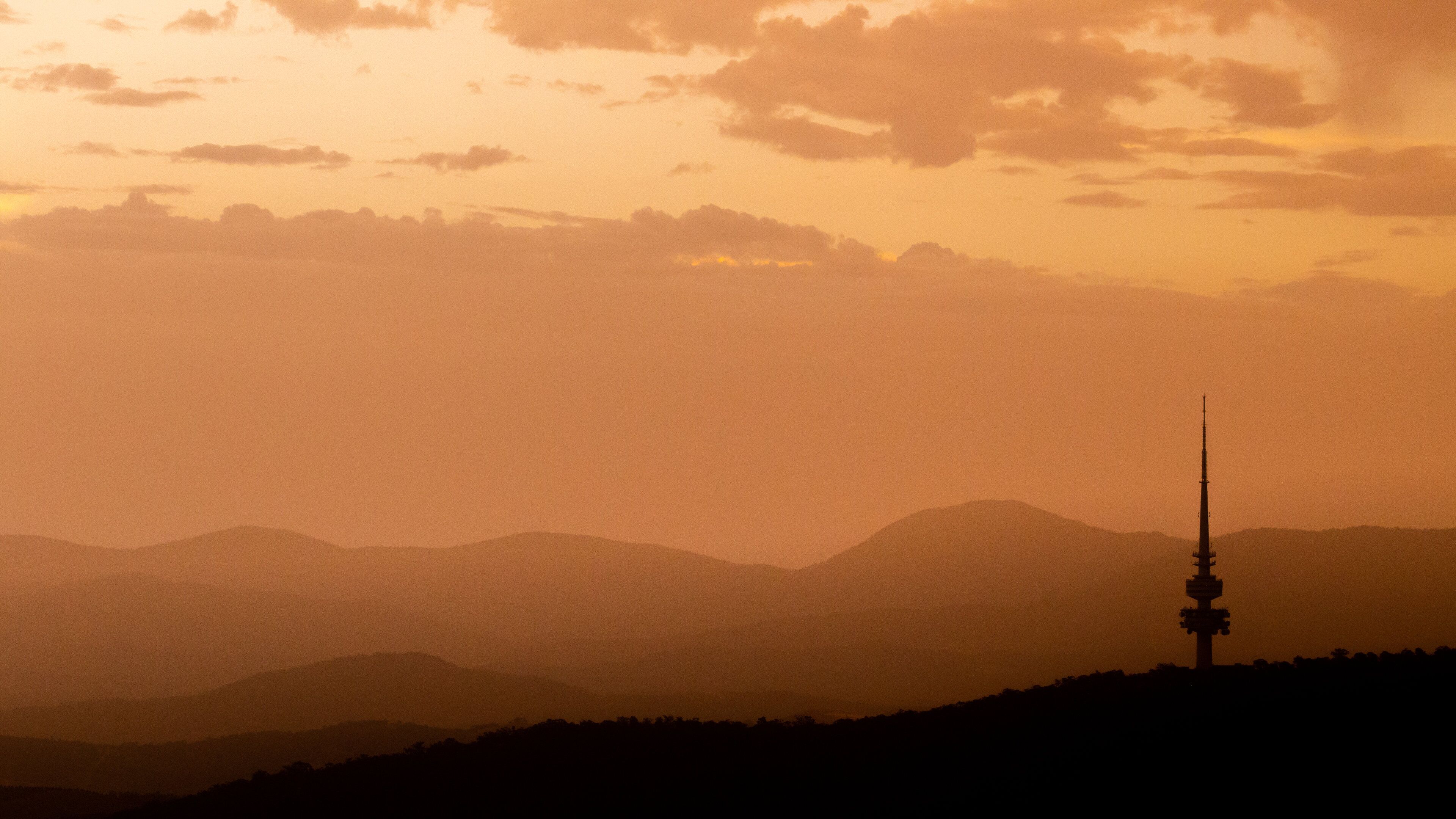 Telstra Tower featuring a sunset and landscape views