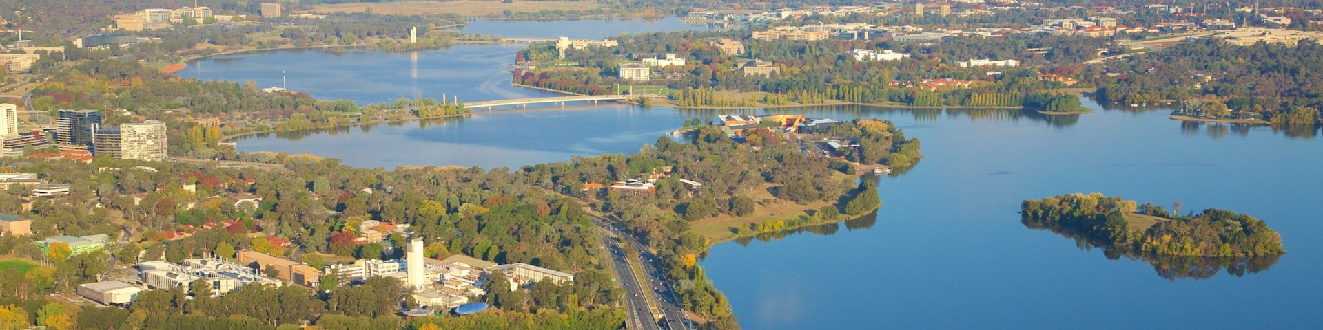 Telstra Tower which includes a lake or waterhole, a city and landscape views