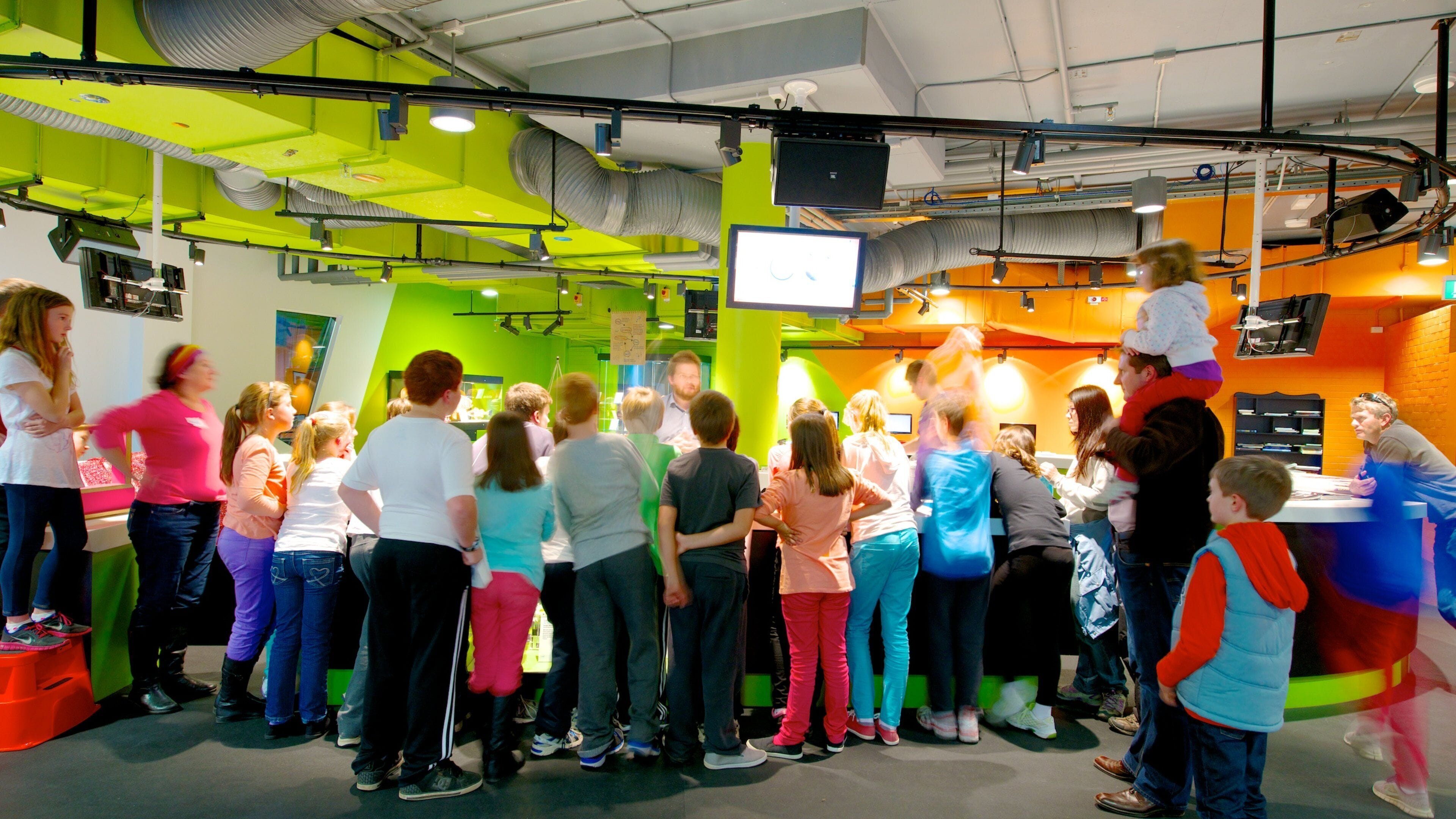 Questacon which includes interior views as well as a large group of people