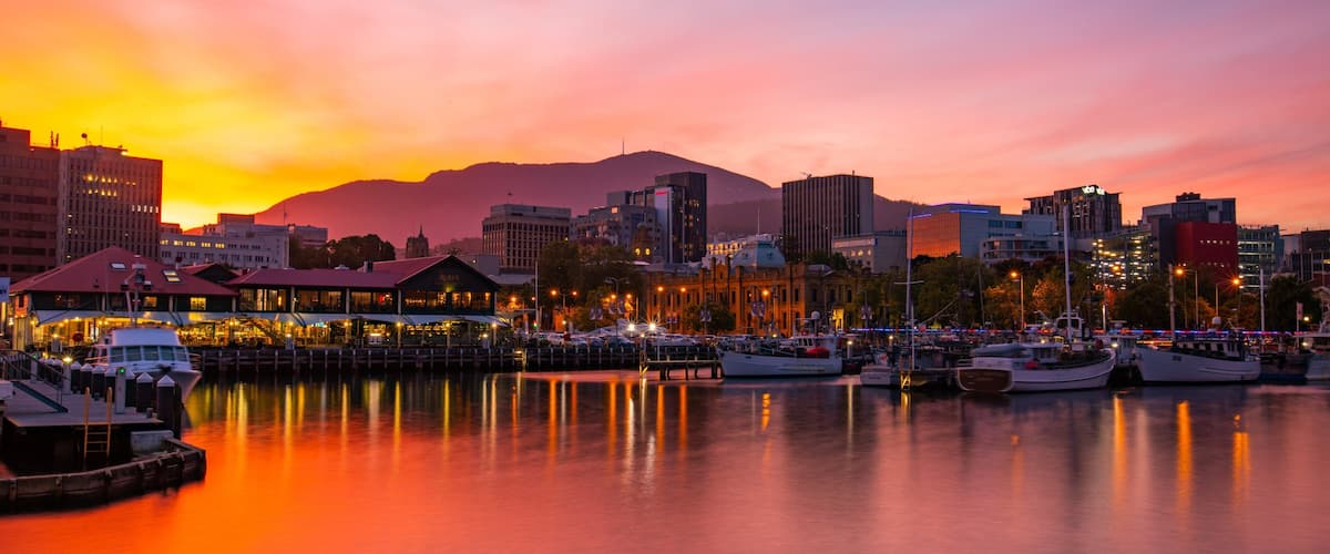 Constitution Dock which includes a sunset and a bay or harbor