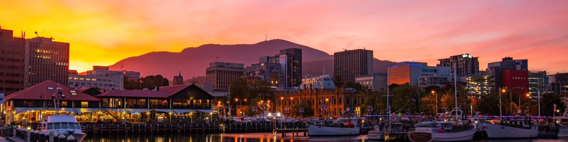 Constitution Dock which includes a sunset and a bay or harbor