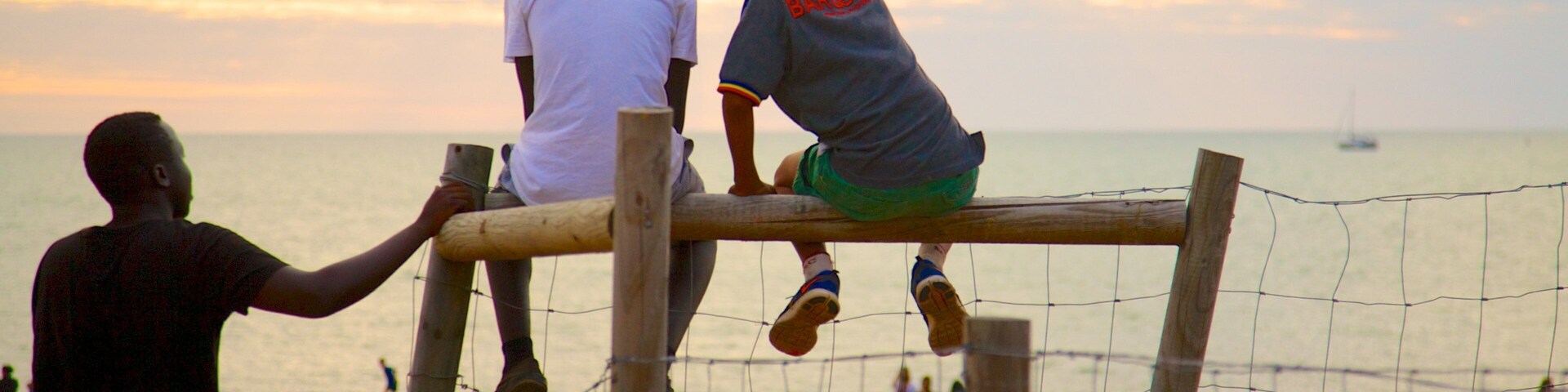 Mindil Beach which includes a sandy beach as well as a small group of people