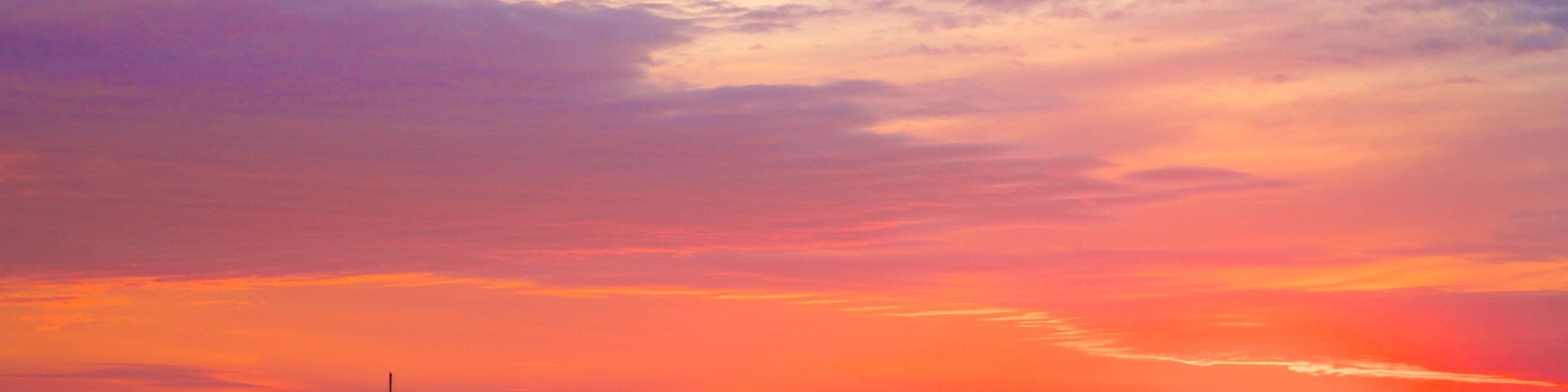 Mindil Beach which includes general coastal views, a sunset and landscape views