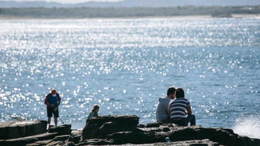 Mooloolaba Beach featuring general coastal views and rugged coastline as well as a couple