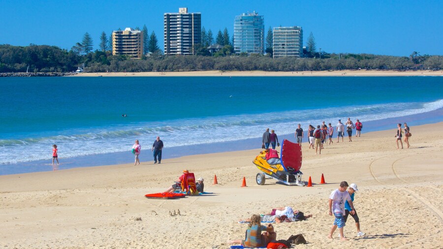 Mooloolaba Beach which includes a beach as well as a large group of people
