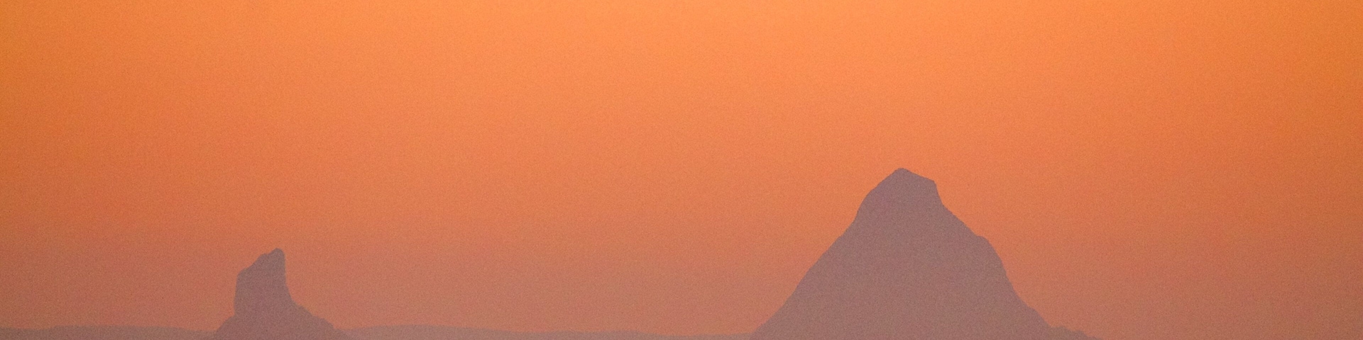 Glasshouse Mountains National Park showing landscape views, a sunset and mountains