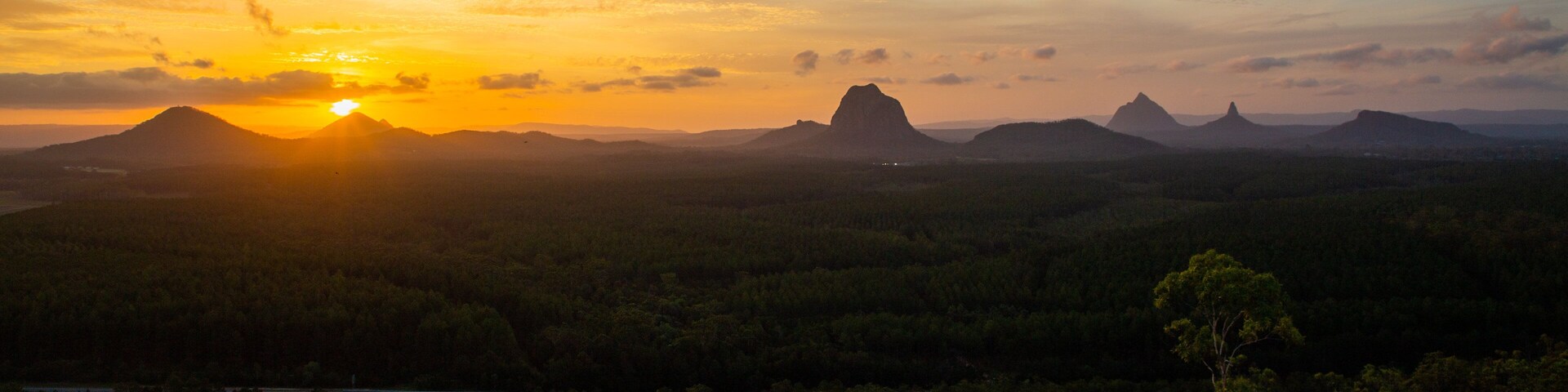 Glasshouse Mountains National Park featuring tranquil scenes, landscape views and a sunset