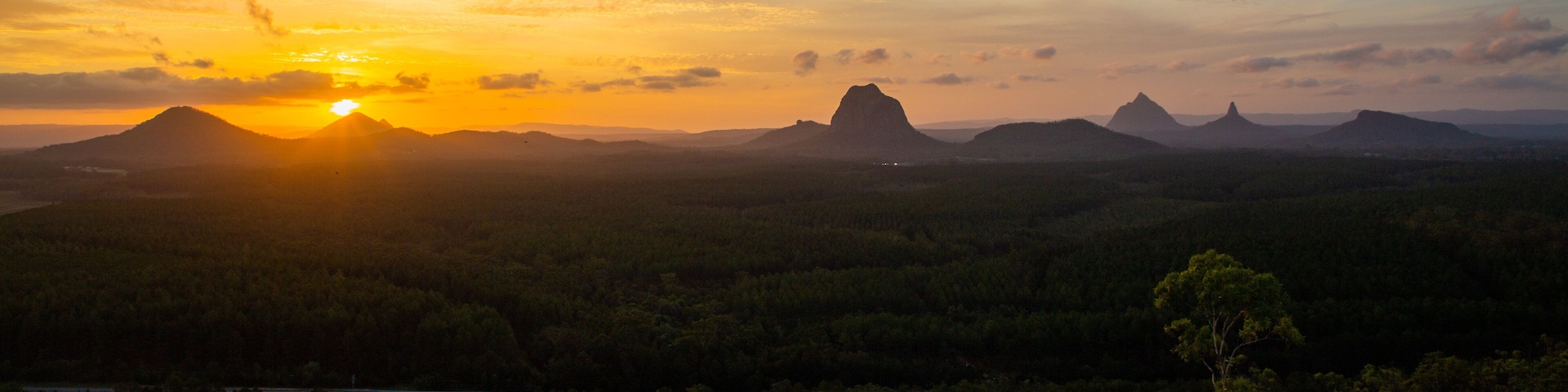 Glasshouse Mountains National Park featuring tranquil scenes, landscape views and a sunset