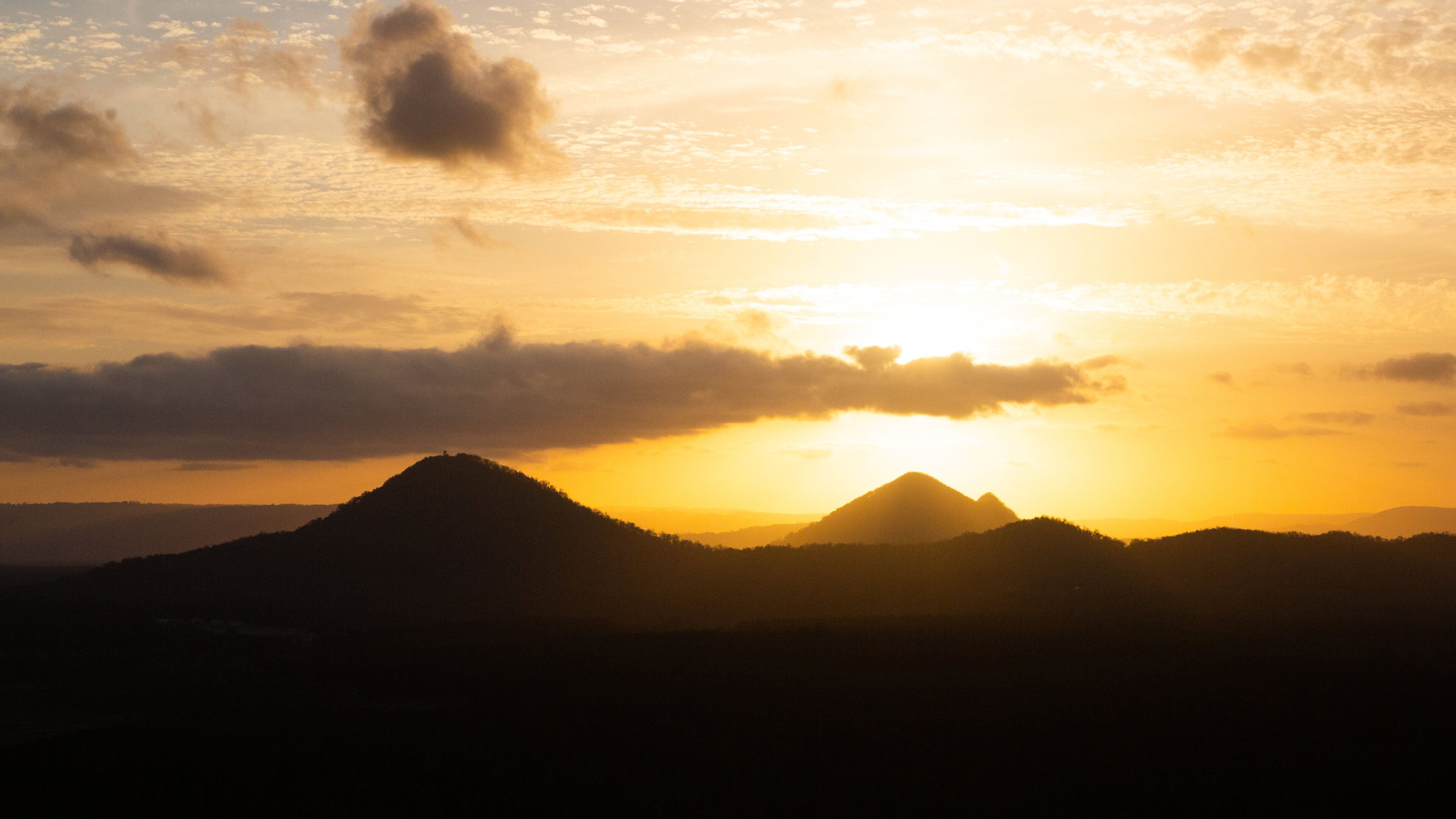 Glasshouse Mountains National Park featuring a sunset, landscape views and tranquil scenes