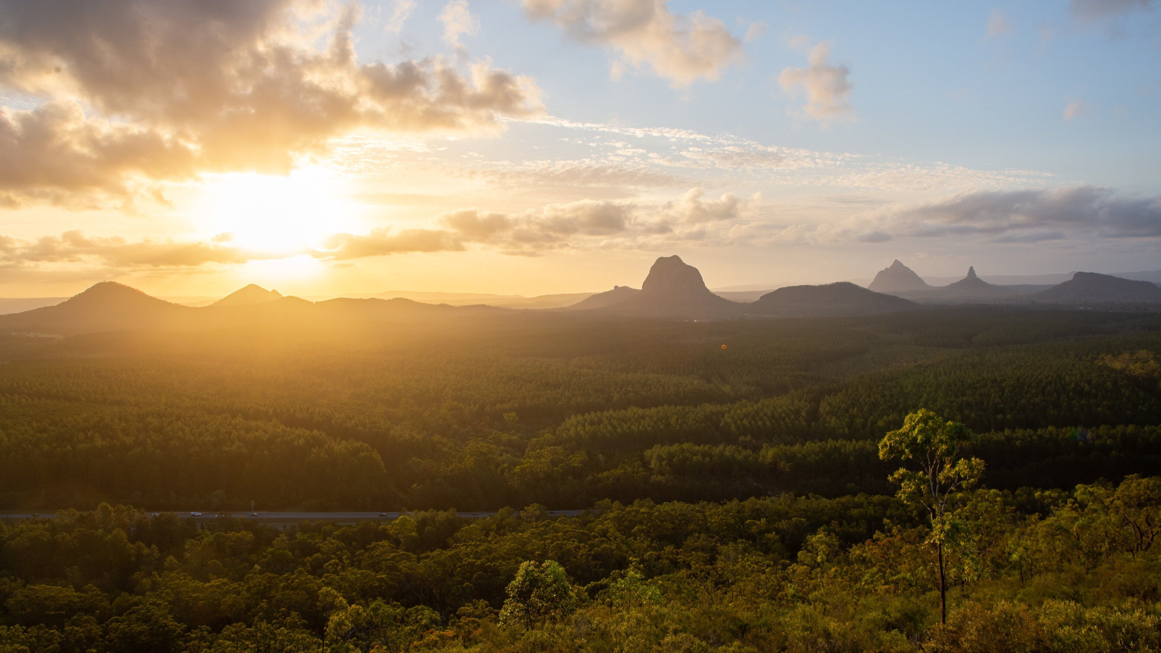Glasshouse Mountains National Park showing a sunset, landscape views and tranquil scenes