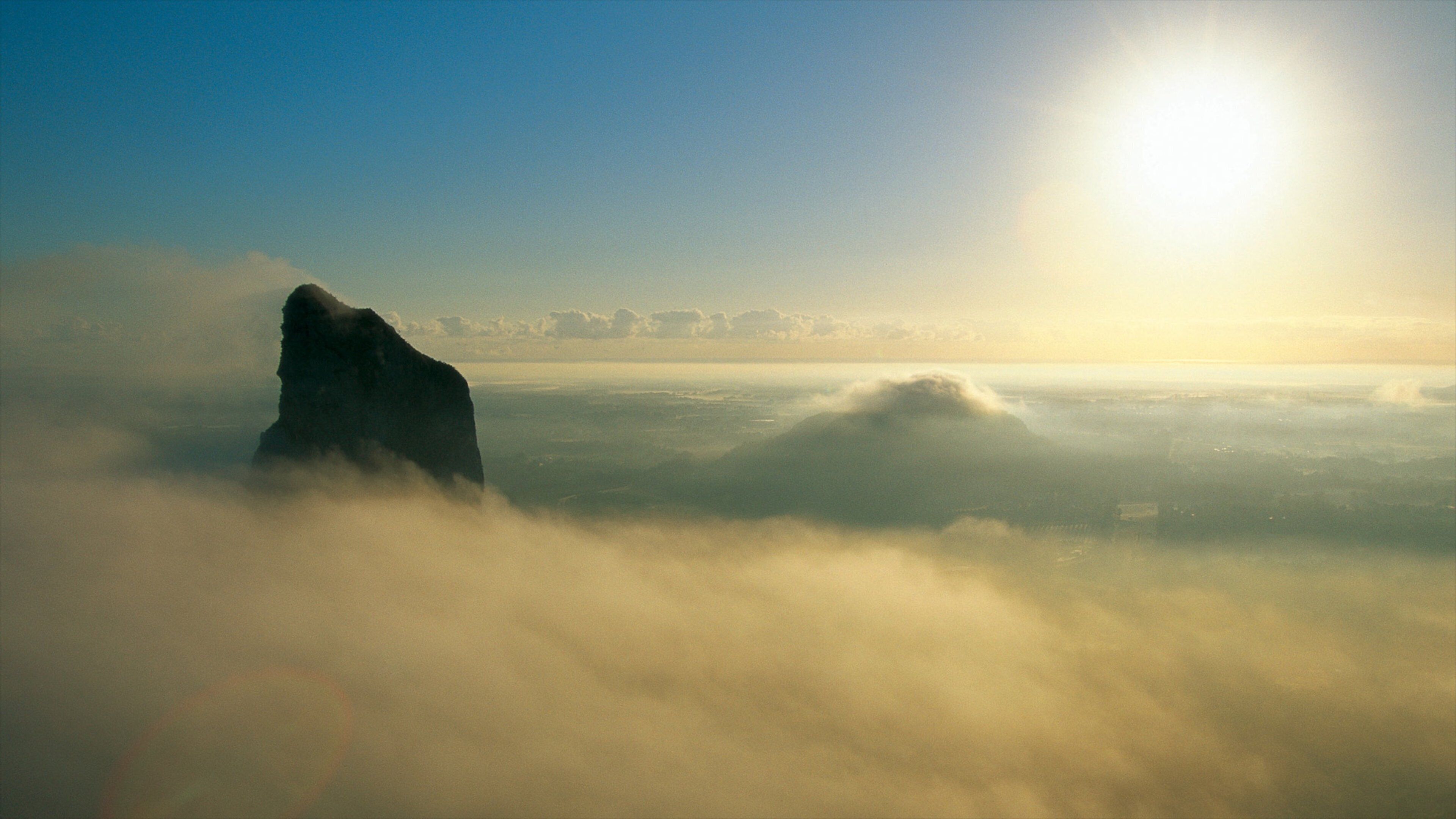 Glasshouse Mountains National Park featuring mist or fog, mountains and landscape views