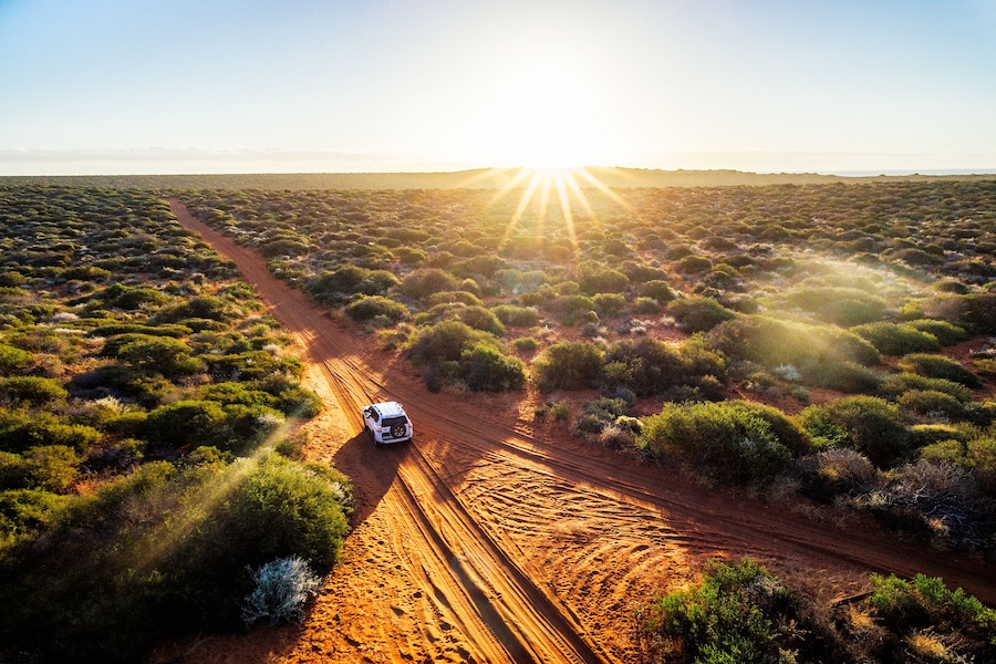 Australia, red sand unpaved road and 4x4 at sunset, Francoise Peron, Shark Bay, Shutterstock ID 681062968, Purchase Order: -