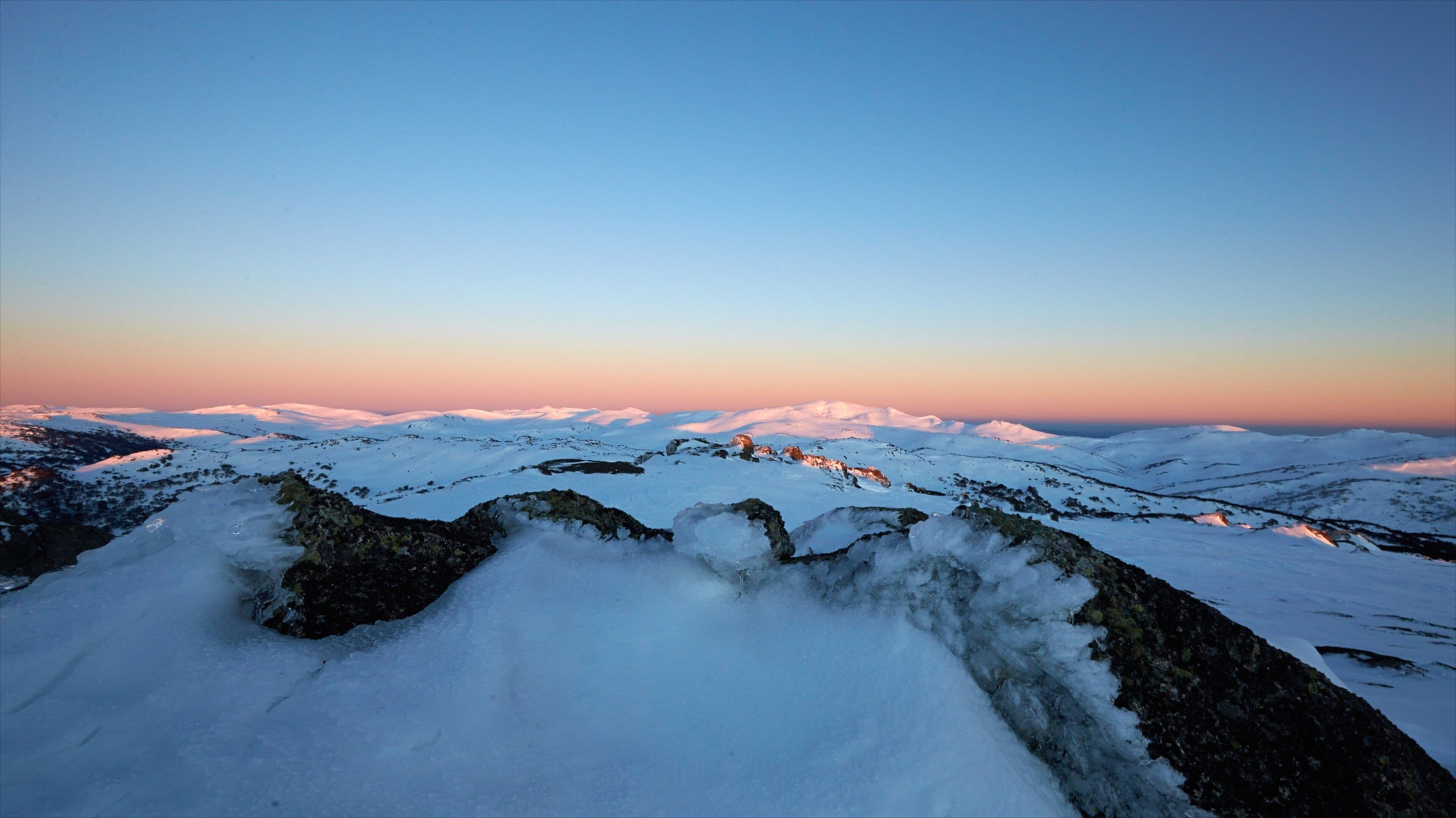 Perisher Ski Resort which includes landscape views, snow and a sunset