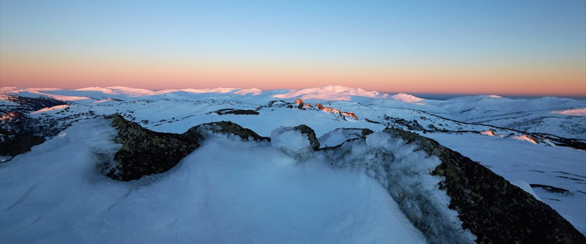 Perisher Ski Resort which includes landscape views, snow and a sunset