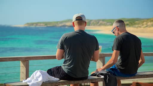 Prevelly Beach showing a sandy beach as well as a small group of people