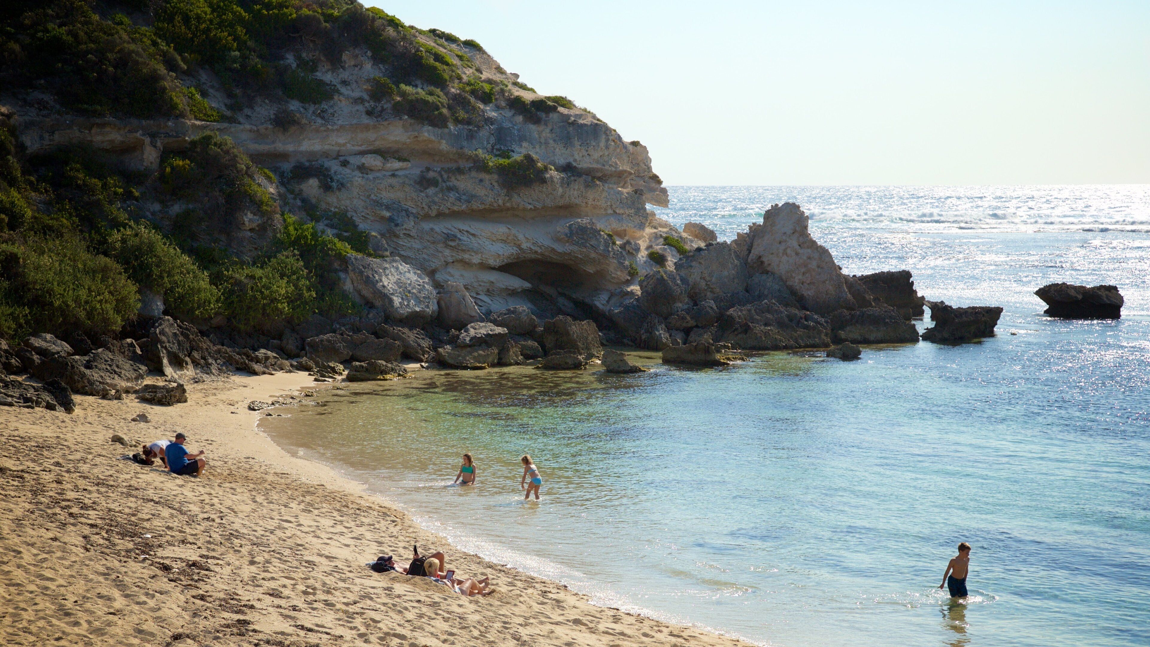 Prevelly Beach showing rocky coastline, a beach and a bay or harbor
