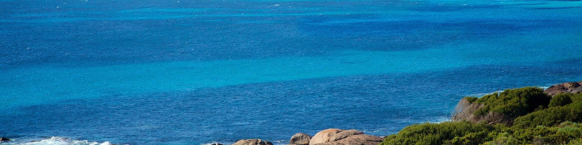Playa de Conto mostrando una playa y costa rocosa
