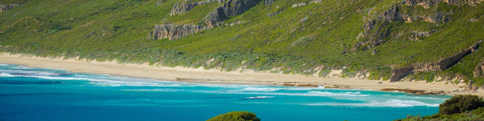Conto Beach featuring a sandy beach and mountains