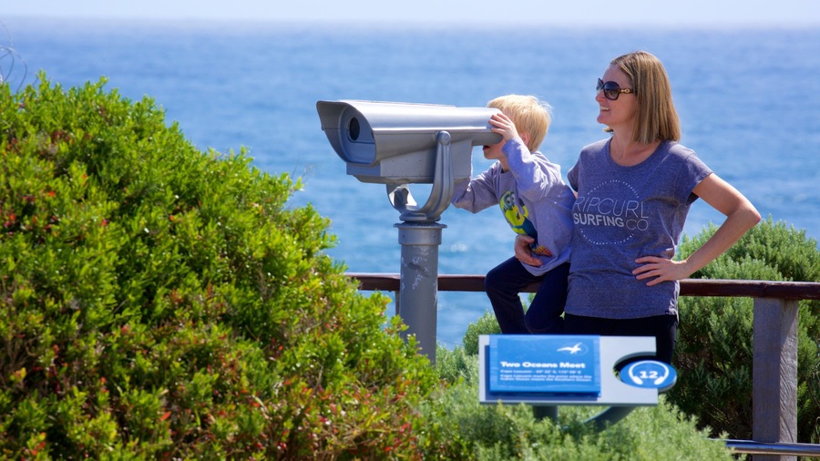 Cape Leeuwin Lighthouse showing signage and general coastal views as well as a family