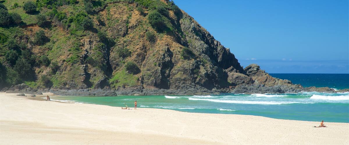 Tallow Beach featuring a beach and rocky coastline