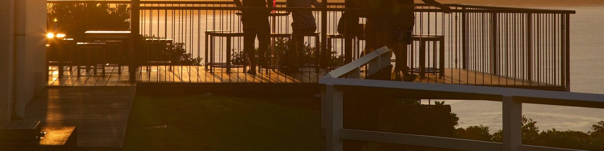 Cape Byron Lighthouse featuring views as well as a small group of people