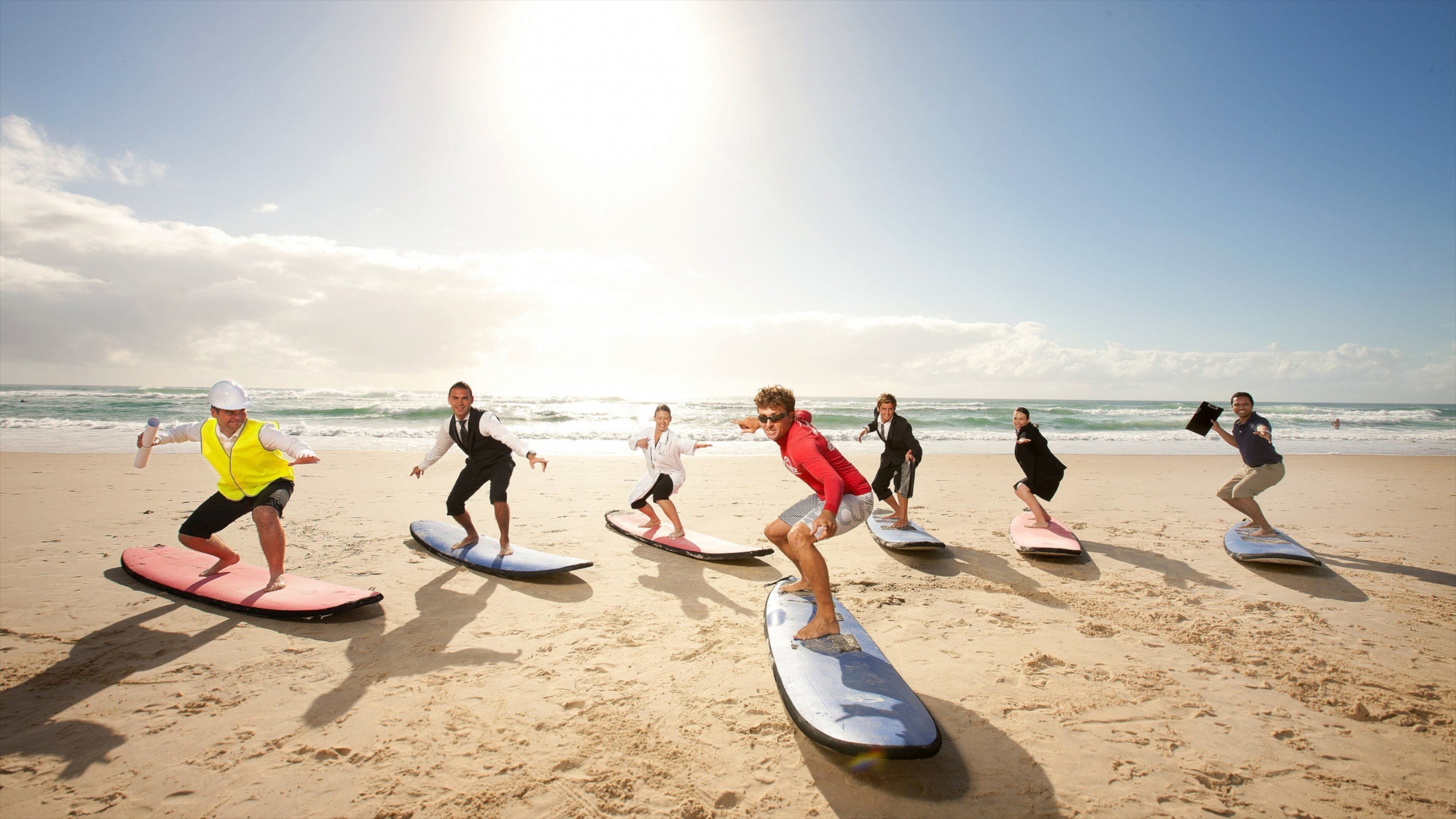 Surfers Paradise Beach which includes a sandy beach, tropical scenes and surfing