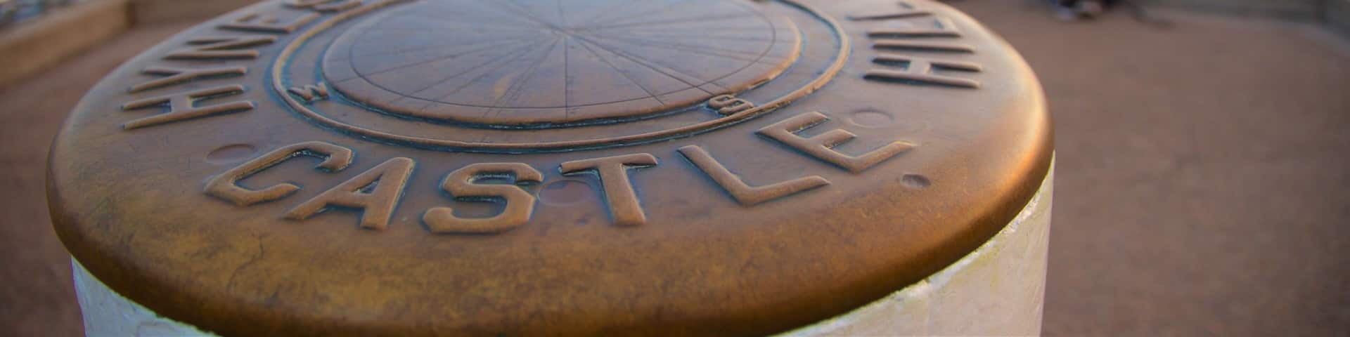 A plaque with the inscription "HAVE A GOOD TIME CASTLE."