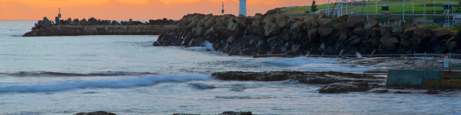 Wollongong North Beach which includes a sunset and a sandy beach