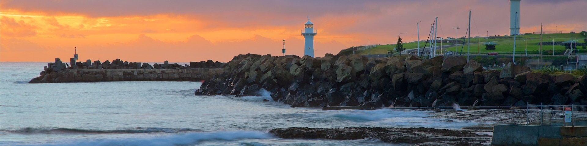 Wollongong North Beach featuring a sunset and a beach