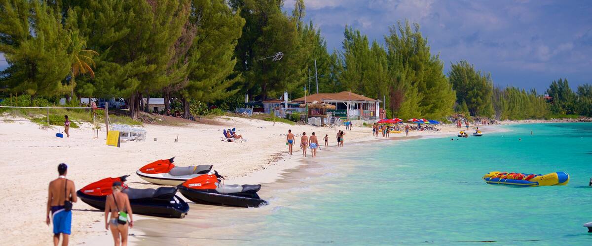 Taino Beach showing tropical scenes, jet skiing and a beach
