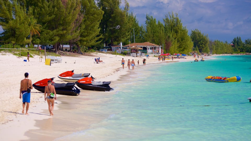 Taino Beach showing tropical scenes, jet skiing and a beach